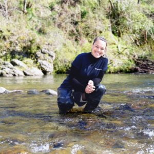 Kati Doehring in a river, image c/o Cawthron Institute