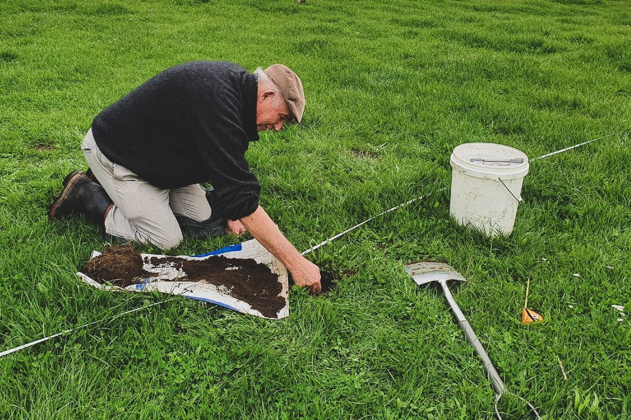 Roger Hill (Hill Laboratories) collecting worms from a spade-square sample