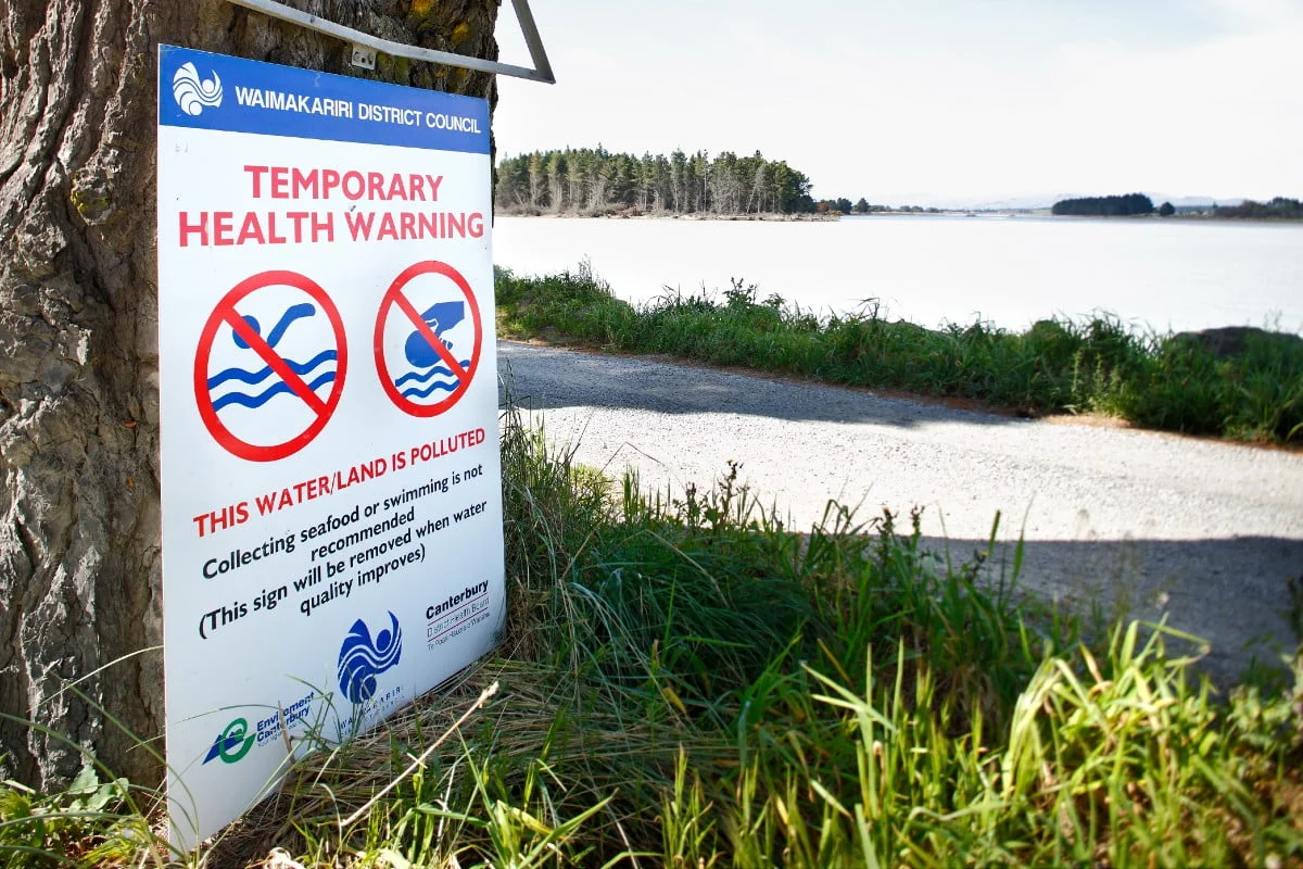 Temporary health warning of polluted water or poor water quality. Environment Canterbury. Waimakariri river mouth. Photo: Rob Suisted